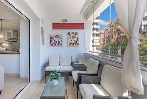 Glassed Balcony: With armchairs, a small table, and a desk. Private and cozy. (1)