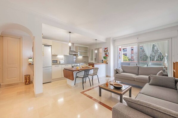 Living Room: Access to the balcony, two sofas, and a sofa bed for 2. (1)