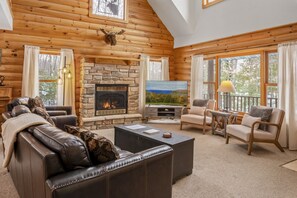 Natural light pours in through the big windows, creating the perfect cozy retreat.