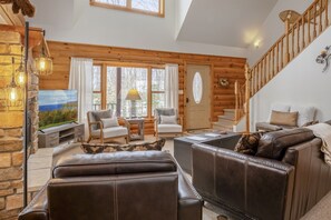 Natural light pours in through the big windows, creating the perfect cozy retreat