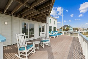 Large second level deck with plenty of seating to enjoy the ocean air and spectacular views.