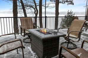 Gather around the outdoor gas firepit, soaking in the warmth as you relax by the lake and watch the flames dance against the night sky.