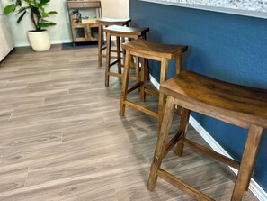 Bar stools provide additional seating along the 11.5 ft kitchen island. 