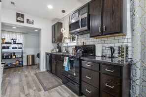 A chef’s dream! Fully equipped with an oven/stove, fridge, dishwasher, microwave, Keurig, kettle, spices, and a convenient pot rack. Plus, a charcoal grill outside for delicious BBQ nights!