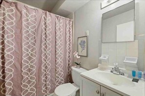 Fully equipped nice clean bathroom with shower and tub hook up.