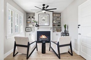 An elegant yet cozy sitting room perfect for unwinding by the fire in timeless comfort.