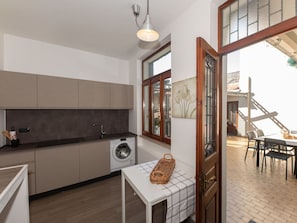 Flooring, Interior Design, Floor, Kitchen, Wood, Furniture, Ceiling, Countertop, Wood Flooring, Cabinetry