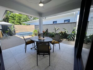 Outdoor dining area / Patio with spa in the background 
