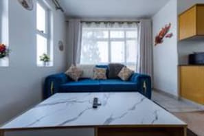 Smart-tv view of the blue couch in the modern living room