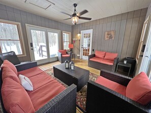 Screen porch with relaxing outdoor furniture