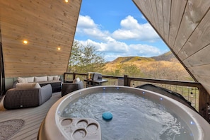Enjoy cooking on the grill or soaking in the hot tub while taking in nature!