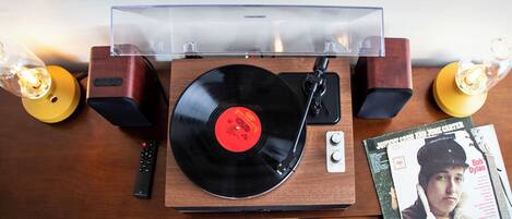 Enjoy our vinyl collection and Bluetooth speakers.