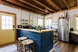 Kitchen has everything you might need to  whip up a meal.