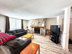 Living room with fireplace & 55" Smart TV