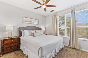 Drift into relaxation in this inviting bedroom with a spacious and comfy king sized bed - Wake up to natural light pouring in through large windows with a lovely view - Peaceful retreat with soft linens and calming decor for a restful night’s sleep
