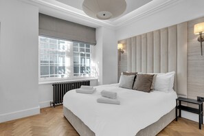 🛏️ Elegant king bedroom with natural light
