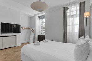 🌤️ Bright bedroom with large Smart TV
