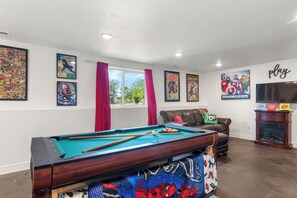Amazing family room with pool table, tv, full kitchen