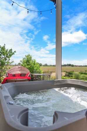Enjoy your own private out door hot tub to relax all your cares away;