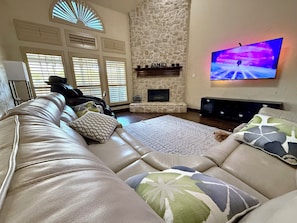 Cozy living room with vaulted ceilings, stone fireplace!