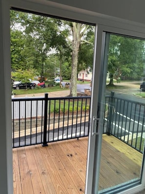 Deck is off living room 2 on second floor. Living room 2 is an open space with a day