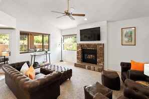 Living area with plenty of comfortable seating and natural lighting