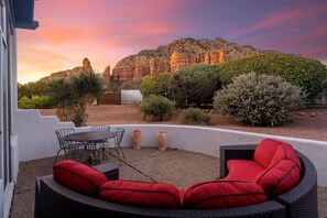 Unwind and enjoy the incredible sunset from your cozy seating area.