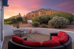 Unwind and enjoy the incredible sunset from your cozy seating area.