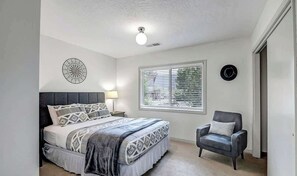 Comfortable master bedroom, ready for a peaceful night's sleep.
