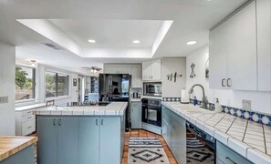 Modern kitchen with all the amenities for a perfect stay.