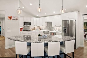 Perfect dine and cook kitchen with lots of overhead lighting and amenities.
