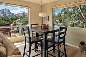 Secondary dining area surrounded by light.