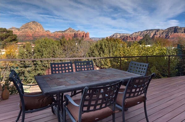 Outdoor dining on the back porch—savor meals al fresco with stunning views.