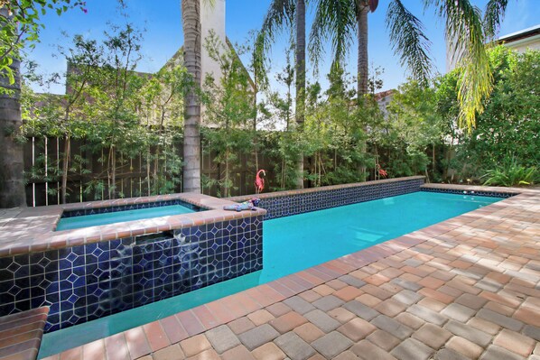 Use of hot tub included, with a poolside view