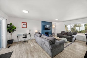 Recently renovated and furnished living room / dining area adjacent to nicely appointed kitchen.