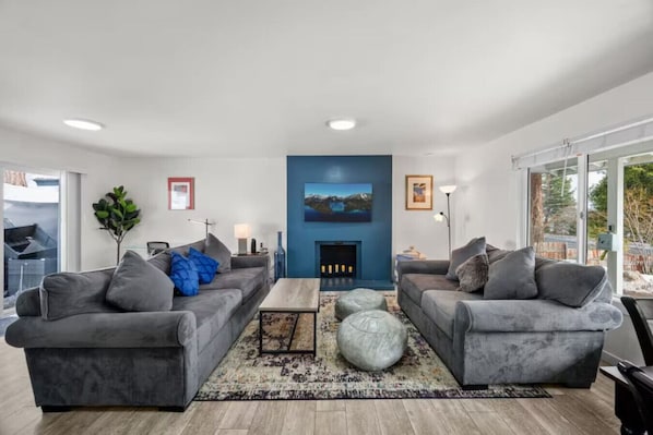 Recently renovated and furnished living room / dining area adjacent to nicely appointed kitchen.