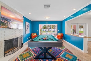 Game room featuring a snooker/pool table and a variety of exciting arcade games