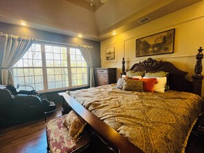 Master bedroom with a massage chair.