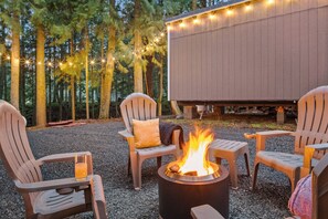 Enjoy a fire with the sound of the creek under the tall trees