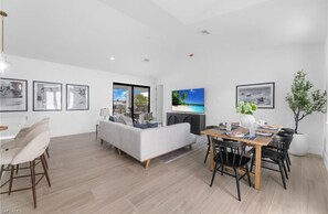 Spacious and bright living area with comfy seating and a coastal vibe