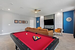 Play a game of pool in the converted game room, after a long day at the Disney parks!