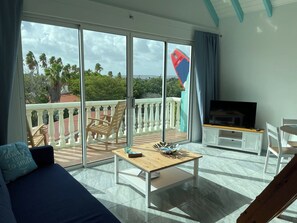 Living room with private balcony and living area. 