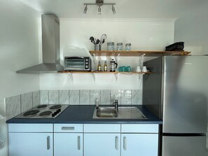 dinnerware, cookware, and utensils provided.