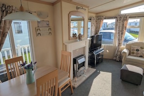 Beautiful living room , with fireplace and large TV ..very comfortable.