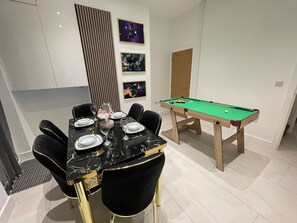 A spacious dining area, perfect for family meals or entertaining guests in a relaxing atmosphere.