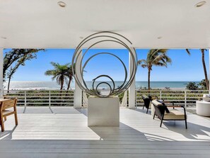 Patio with artwork reminiscent of Rauschenberg's style 