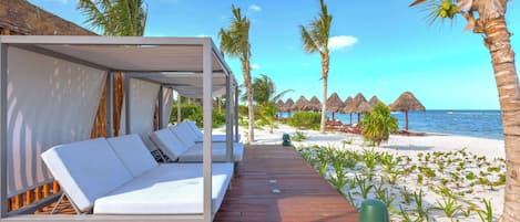 Unwind in our private beach cabanas.