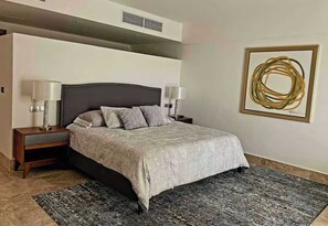 Restful king-size bed awaits a relaxing night's sleep.