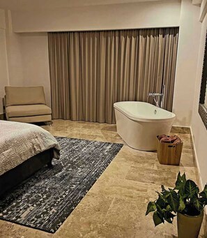 Indulge in a relaxing soak in your private, luxurious tub. Sweet dreams await!