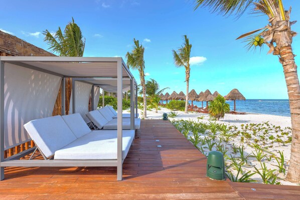 Beachfront cabanas for ultimate relaxation.
